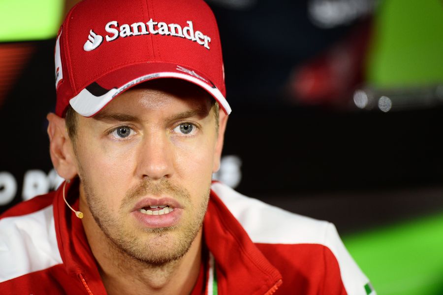 Sebastian Vettel talks to media in the press conference