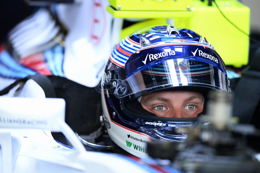 Valtteri Bottas sits in the Williams cockpit in the garage