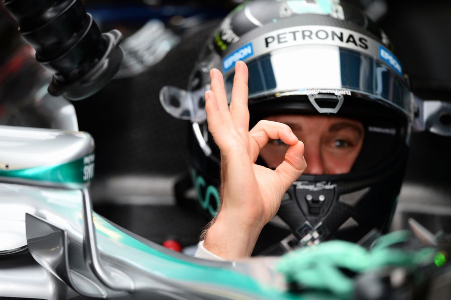 Nico Rosberg gives an OK sign from the cockpit
