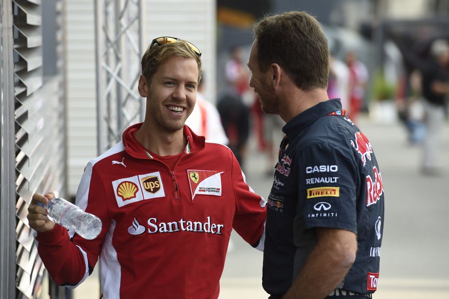 Sebastian Vettel talks with his former boss Christian Horner