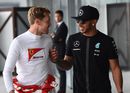 Sebastian Vettel and Lewis Hamilton share a joke 