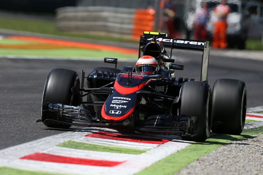 Jenson Button runs wide in the McLaren