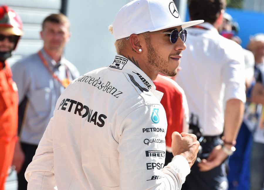 Lewis Hamilton celebrates his pole