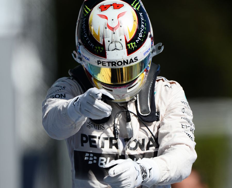 Lewis Hamilton celebrates his win in parc ferme