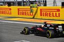 Fernando Alonso passes his pit board