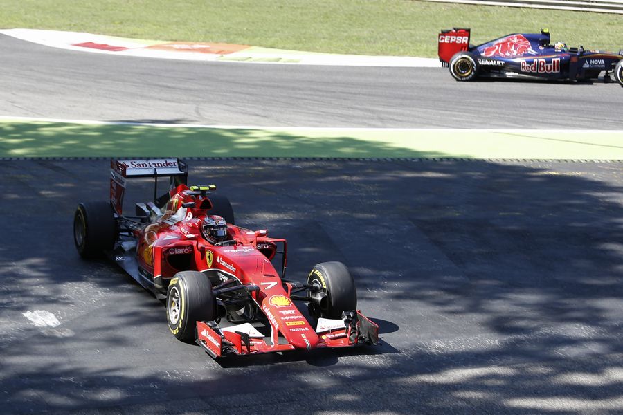 Kimi Raikkonen runs wide as he tries to pass Carlos Sainz