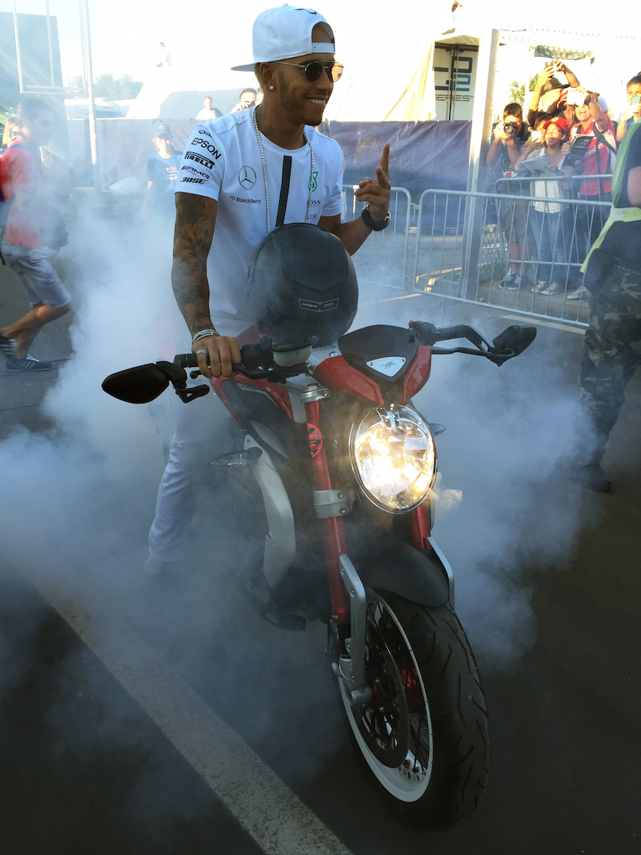 Lewis Hamilton performs a burnout on his MV Agusta Dragster RR motorcycle
