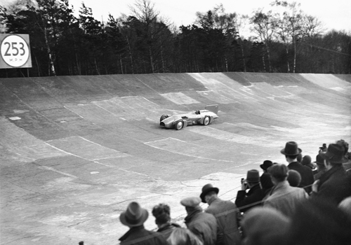 Sir Malcolm Campbell drives his famous Bluebird car around the track at Brooklands