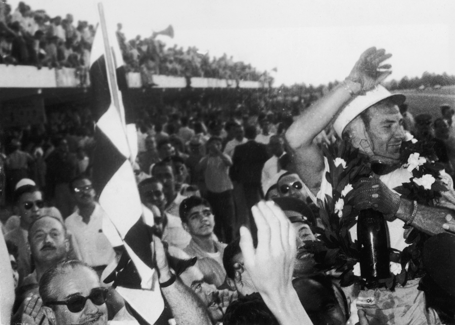 Stirling Moss celebrates victory in the Argentine Grand Prix