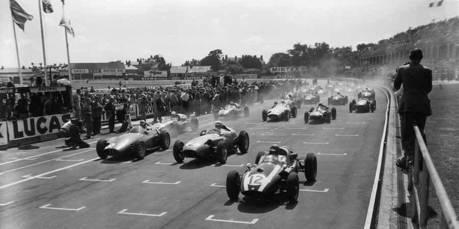 Jack Brabham (No. 12) leads away Roy Salvadori (No. 2) and Harry Schell (No. 8) at the start of the British Grand Prix
