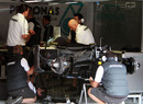 Mercedes engineers work on the W01 in the garage