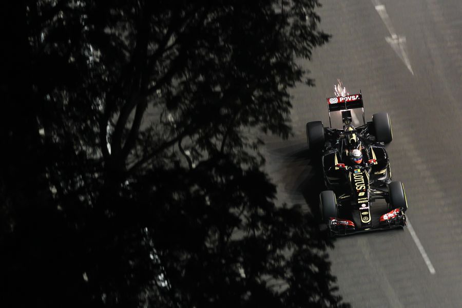 Sparks fly from Romain Grosjean's Lotus