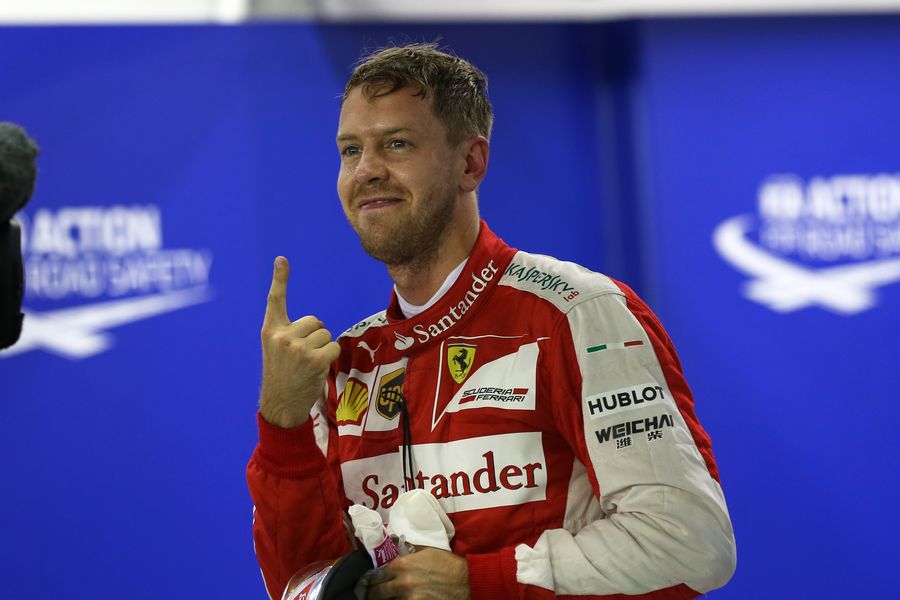 Sebastian Vettel celebrates taking pole position