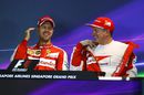 Sebastian Vettel and Kimi Raikkonen share a joke in the press conference