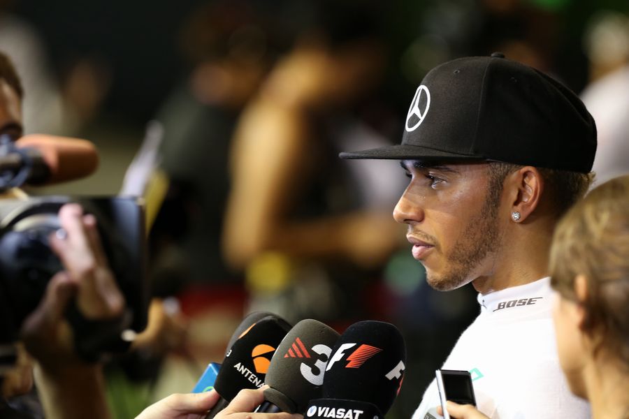 Lewis Hamilton talks with the media after his retirement