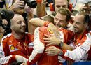 Sebastian Vettel celebrates his win with the team in parc ferme