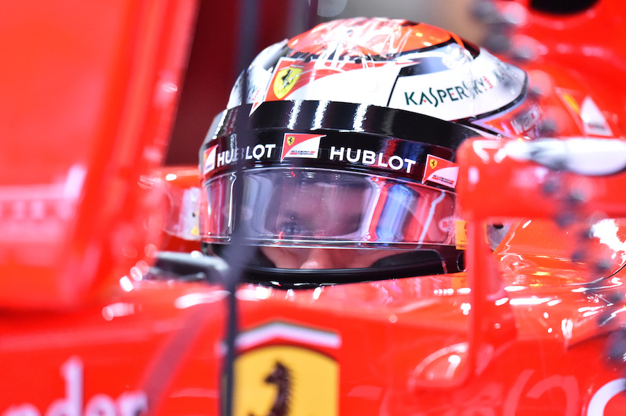 Kimi Raikkonen waits in the cockpit
