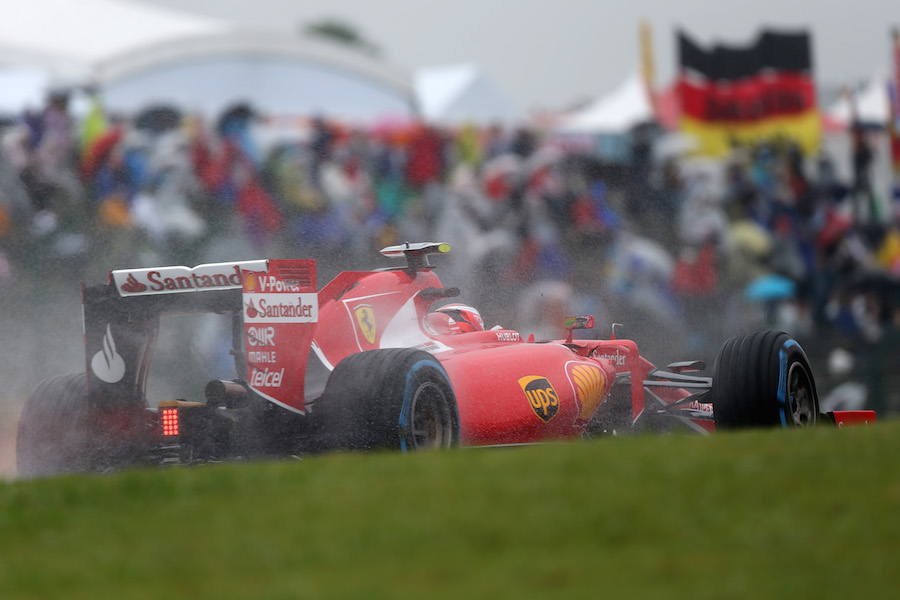 Kimi Raikkonen on wet track in his Ferrari