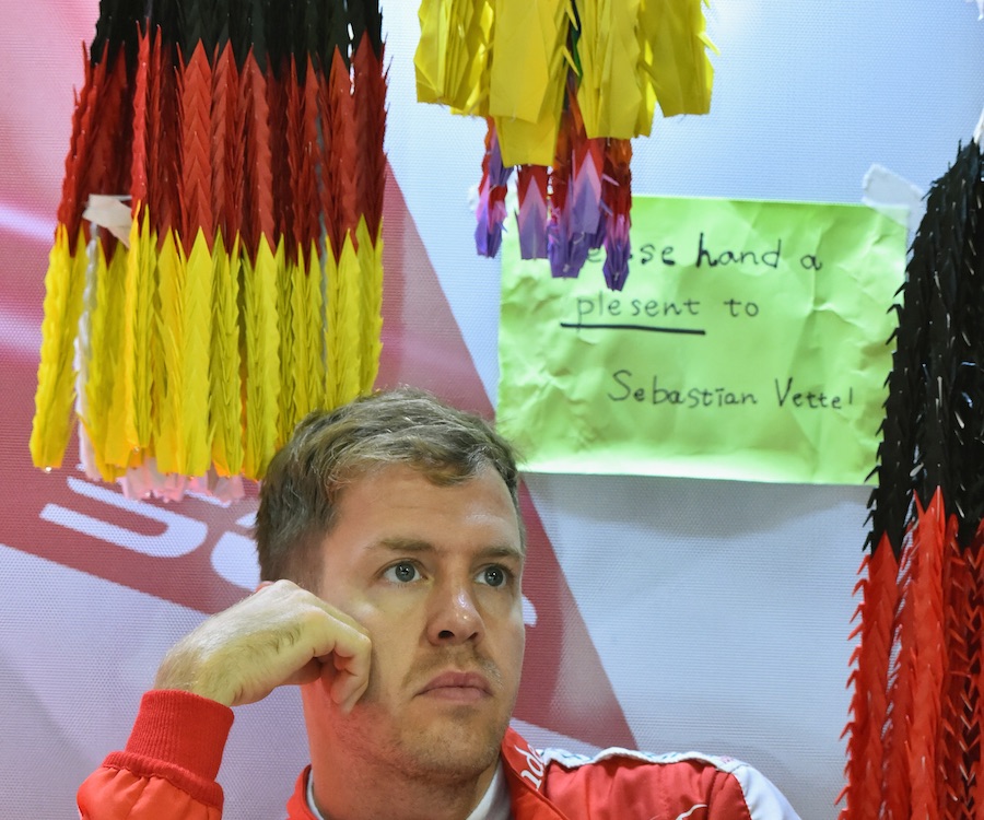 Sebastian Vettel waits for improving the condition in the garage