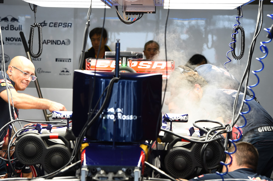 Max Verstappen's STR10 with dry ice in the garage