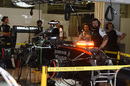 Fernando Alonso's MP4-30 with KERS warning light illuminated in the garage