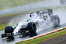 Felipe Massa drives through the spray
