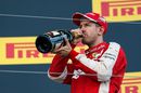Sebastian Vettel celebrates with champagne