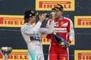 Nico Rosberg and Sebastian Vettel celebrate with champagne