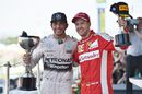 Lewis Hamilton and Sebastian Vettel pose on the podium