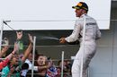 Lewis Hamilton celebrates with champagne