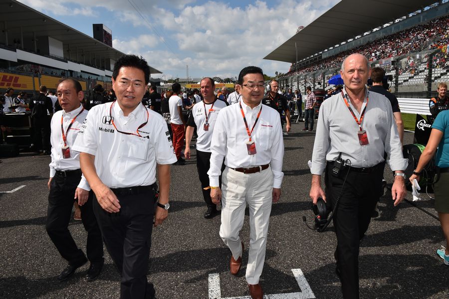 Takahiro Hachigo and Ron Dennis on the grid with Yasuhisa Arai