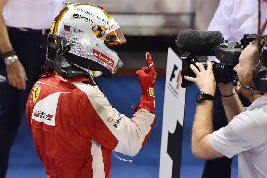 Sebastian Vettel celebrates his win in parc ferme