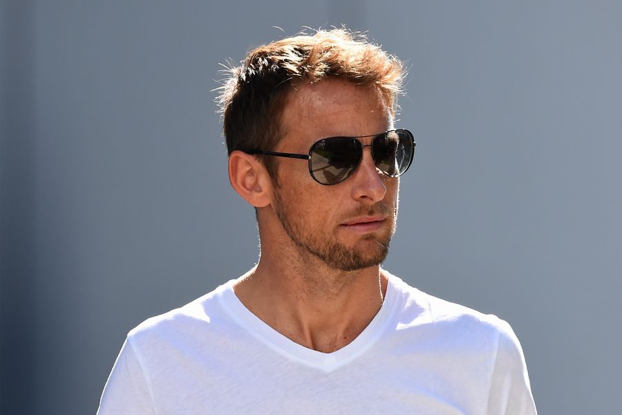 Jenson Button walks through the paddock
