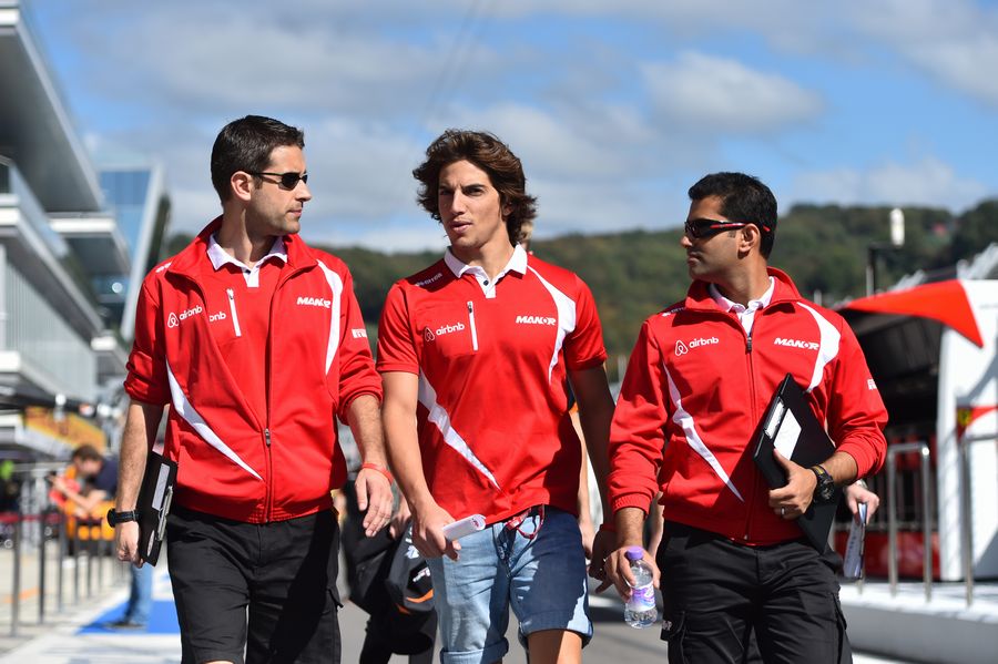 Roberto Merhi walks the track with engineers