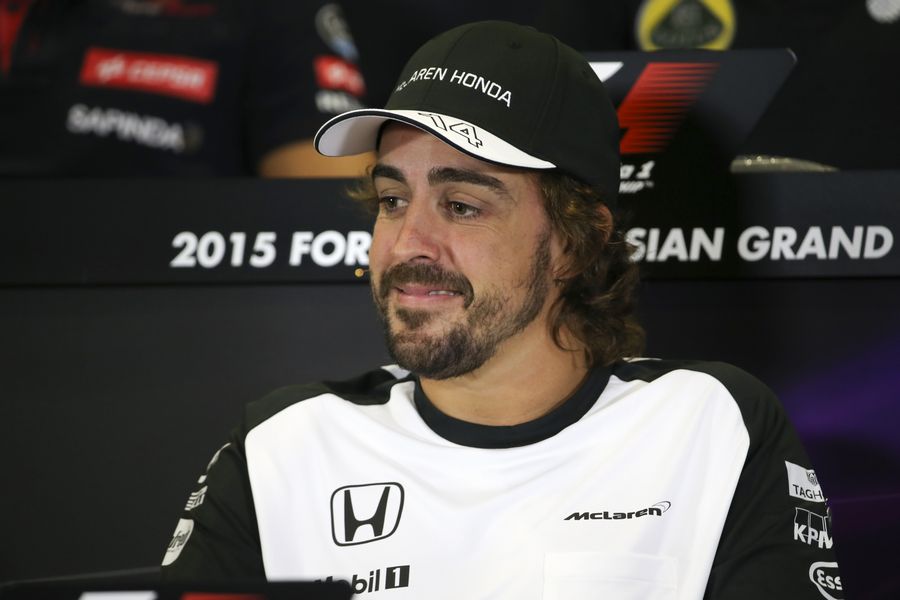 Fernando Alonso speaks to media in the press conference