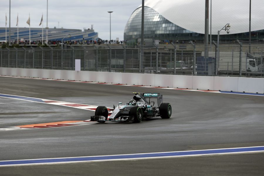 Nico Rosberg runs through the wet track
