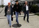 Niki Lauda and Toto Wolff walk through the paddock with Helmut Marko