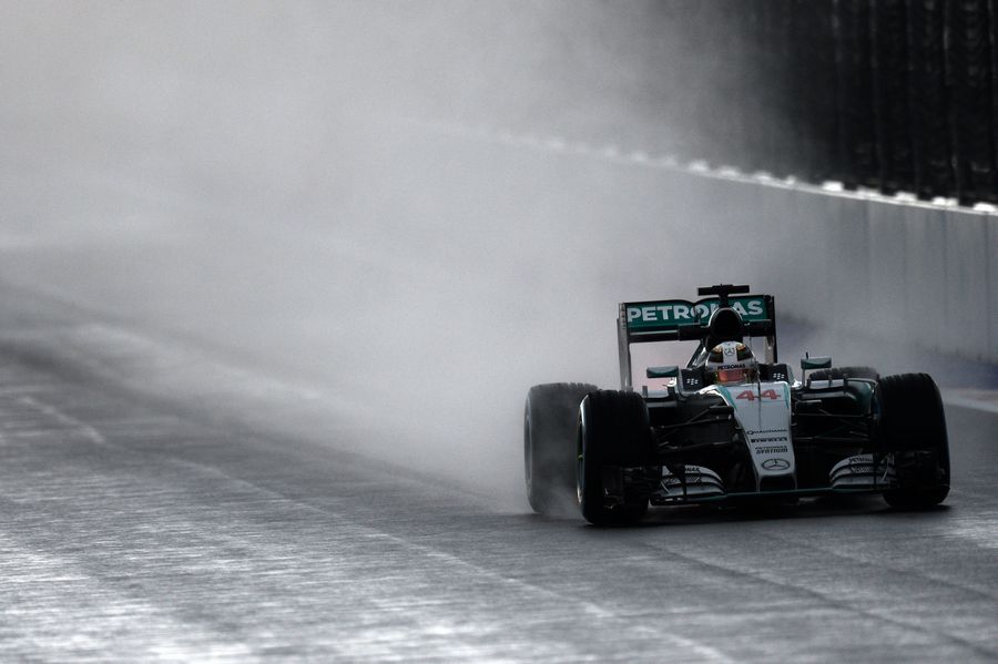 Lewis Hamilton navigates through the wet conditions