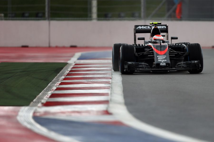 Jenson Button getting to grips with the McLaren in the wet