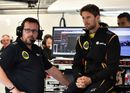Romain Grosjean watches the session in the garage