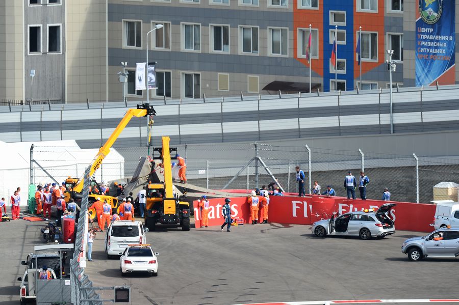 Medical crews attend to Carlos Sainz following his crash in FP3