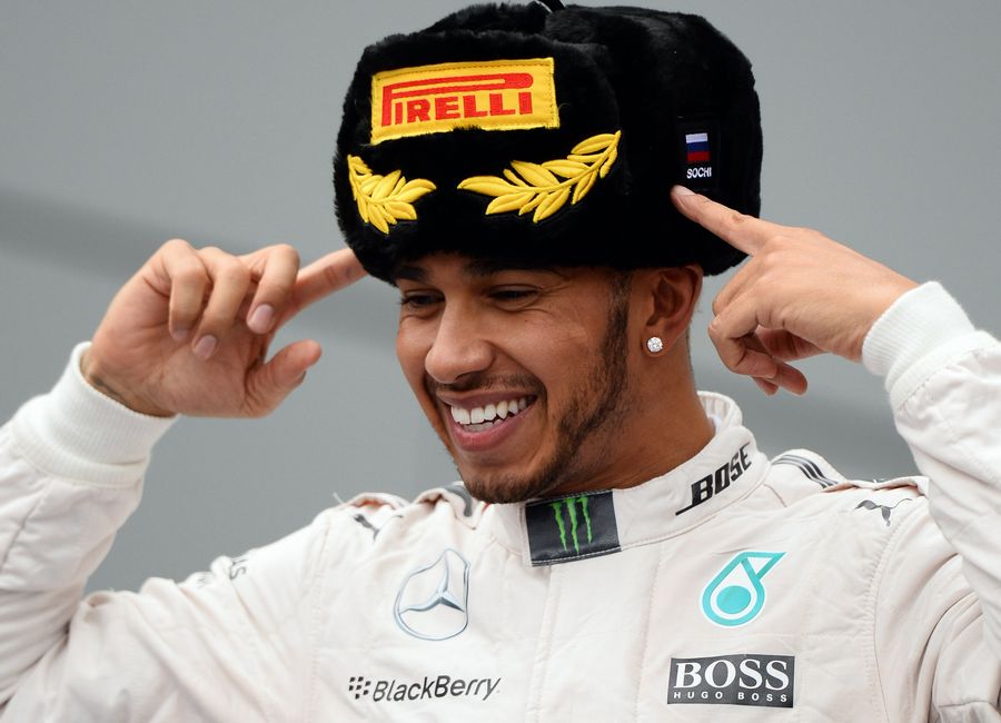 Lewis Hamilton celebrates his win on the podium