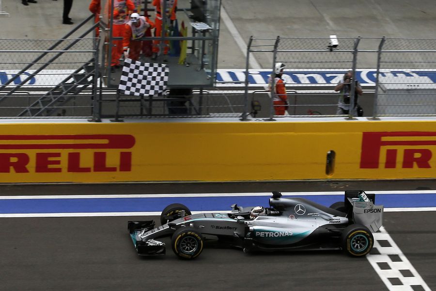 Lewis Hamilton takes the chequered flag