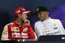Lewis Hamilton chats with Sebastian Vettel during the press conference after the race
