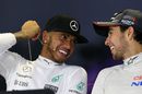 Lewis Hamilton shares a joke with Sergio Perez during the press conference after the race