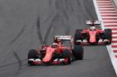 Kimi Raikkonen battles for a position with his teammate Sebastian Vettel
