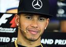 Lewis Hamilton looks on during the press conference