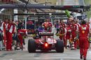 Sebastian Vettel makes a pit stop during FP1