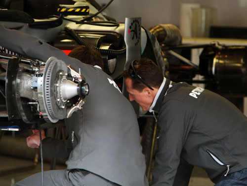Michael Schumacher takes a closer look at the Mercedes