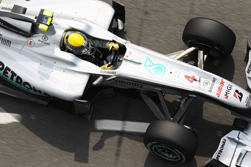 Nico Rosberg returns to his pit garage 